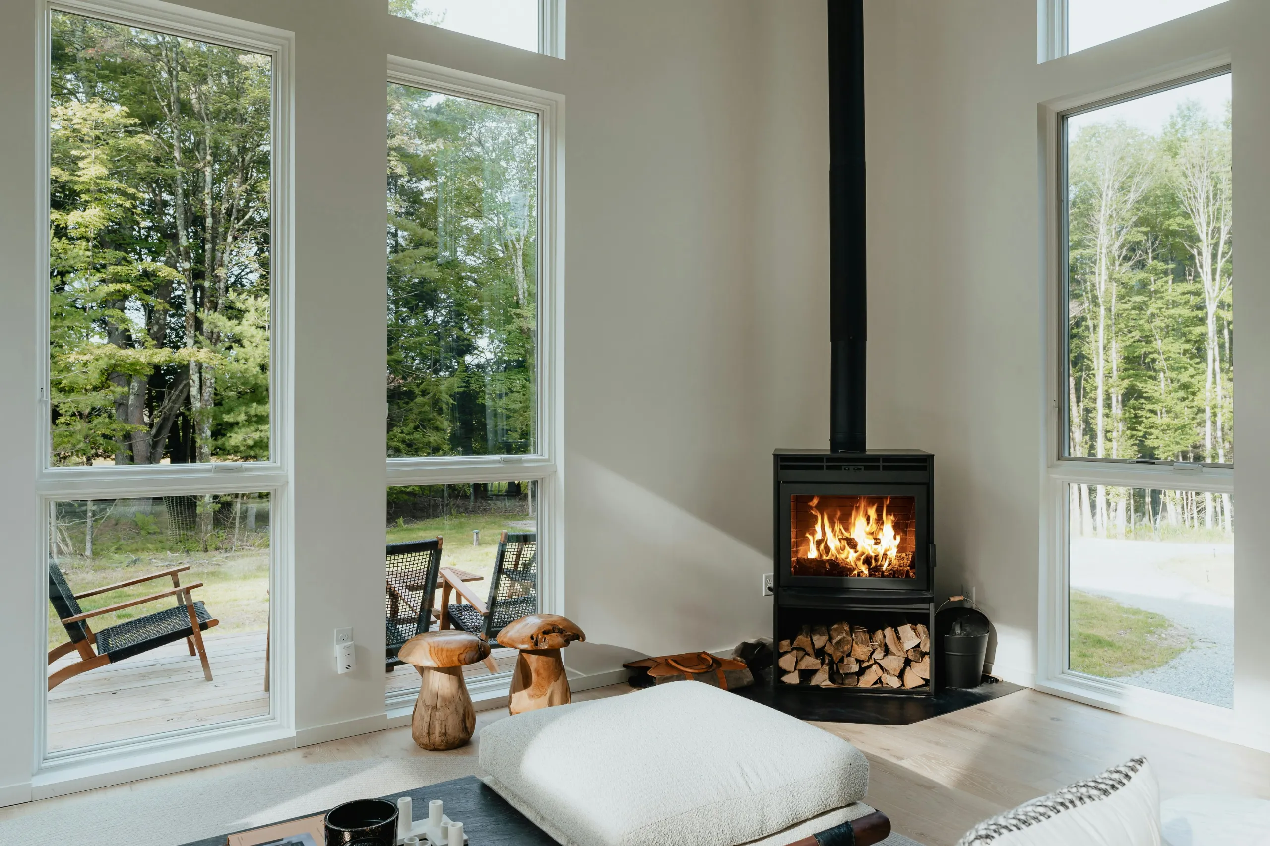 A living room with a sectional sofa, a coffee table, and a fireplace.