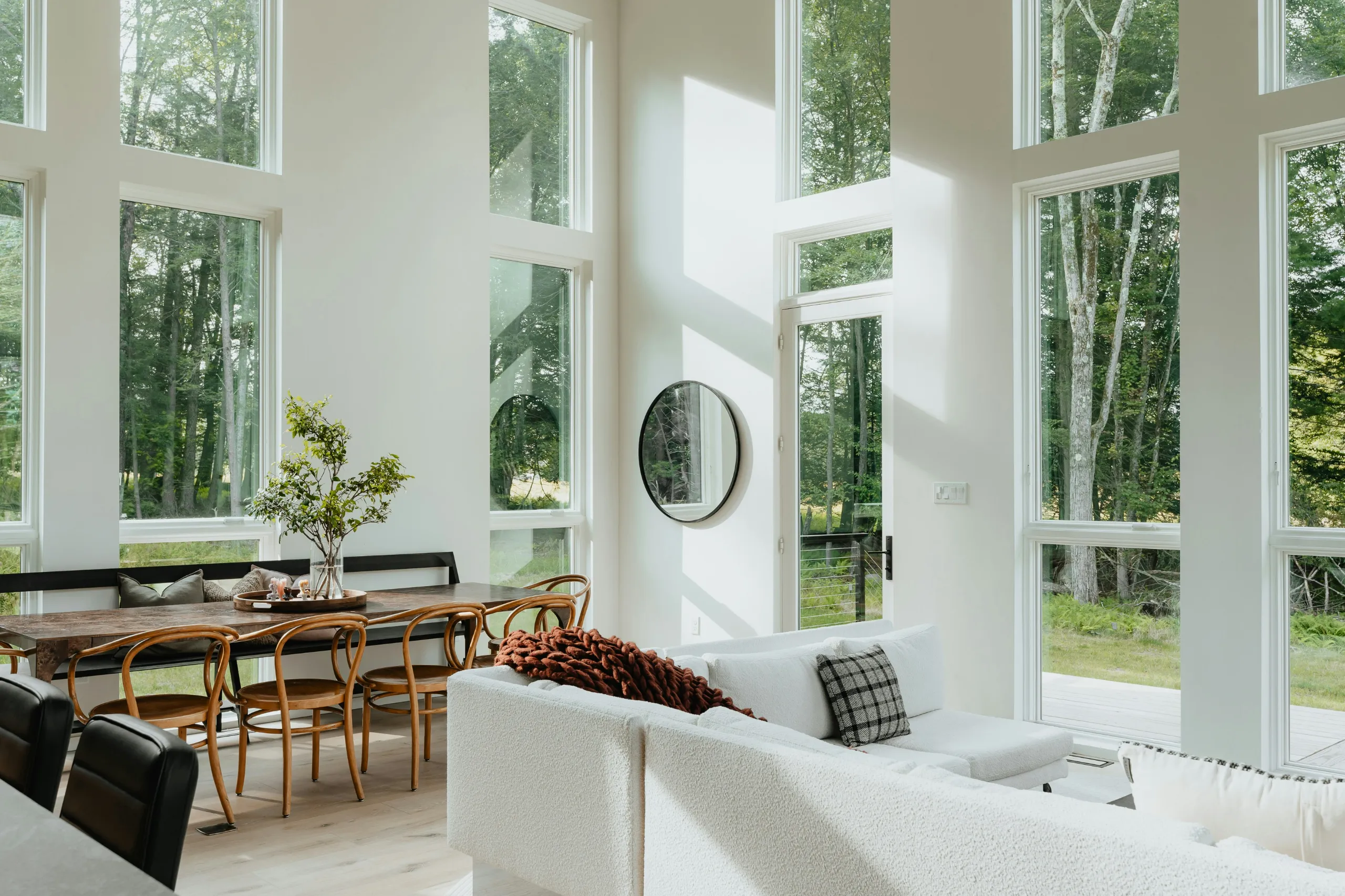 A living room with a sectional sofa, a coffee table, and a fireplace.